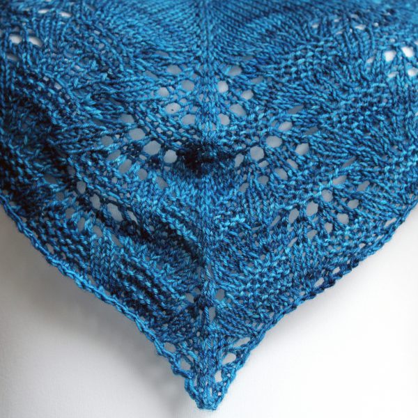 A close up the centre of the cowlette showing the rippling lace and textured border