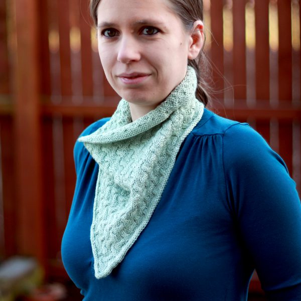 A modelled shot of the bandana version of Ripples in the Mist cowl with cables and i-cord edging