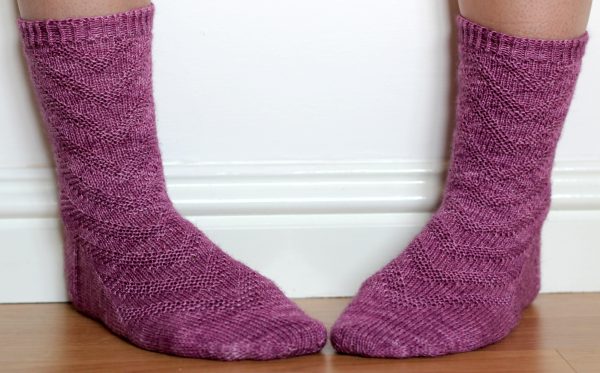 Purple socks with a textured chevron pattern repeated up the sock