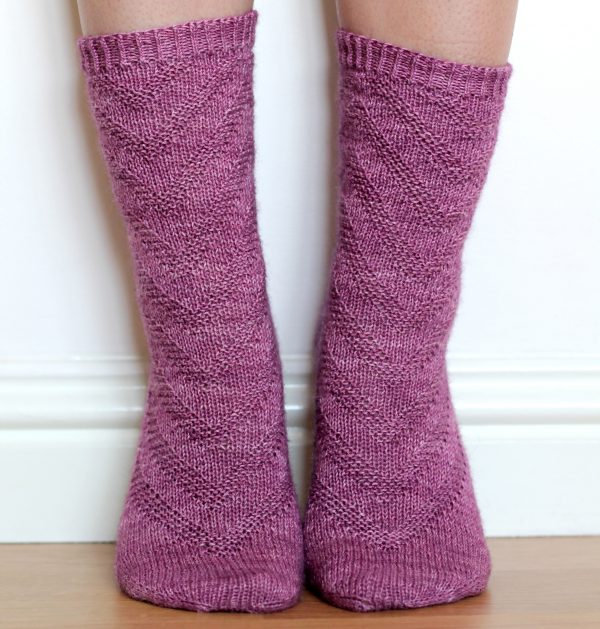 Purple socks with a textured chevron pattern repeated up the sock