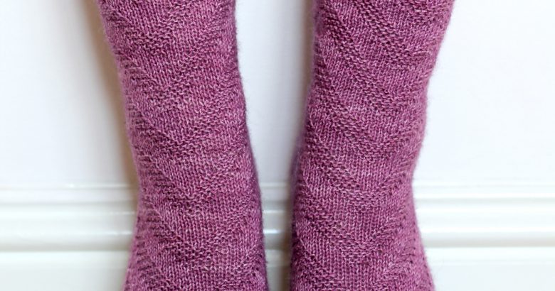 Purple socks with a textured chevron pattern repeated up the sock