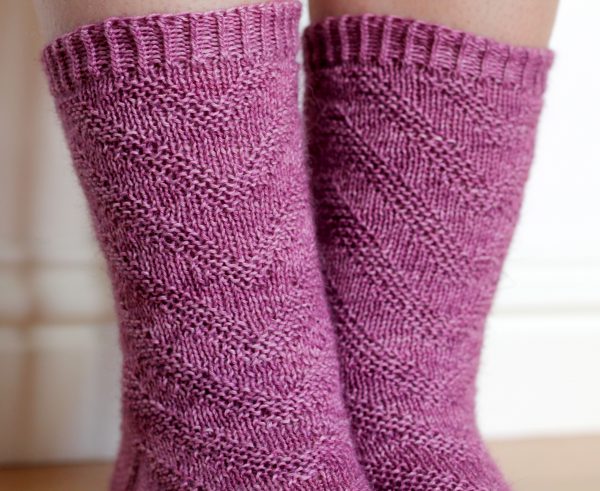 Purple socks with a textured chevron pattern repeated up the sock