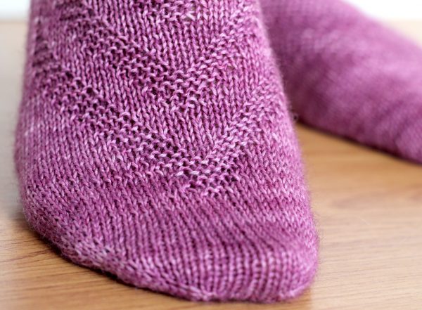 Purple socks with a textured chevron pattern repeated up the sock