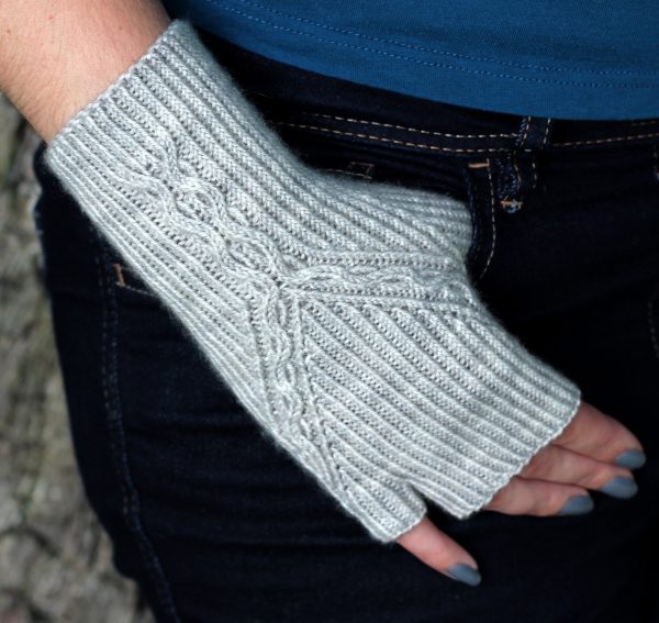 Twisted Rib fingerless mitts with a cable up the centre of the back of the wrist and splitting to either side of the hand