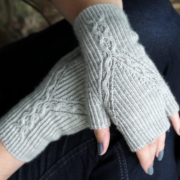 Twisted Rib fingerless mitts with a cable up the centre of the back of the wrist and splitting to either side of the hand