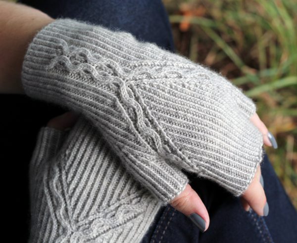 Twisted Rib fingerless mitts with a cable up the centre of the back of the wrist and splitting to either side of the hand