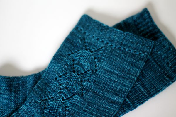 Blue socks with a column of lace up the outside of the foot