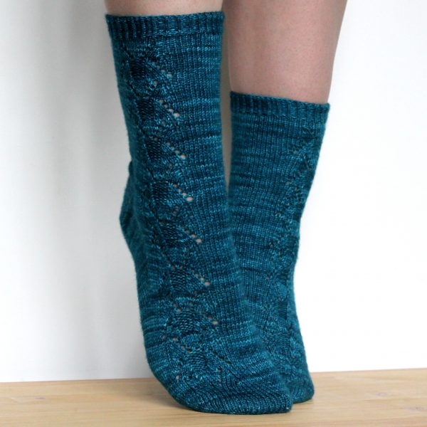 Blue socks with a column of lace up the outside of the foot