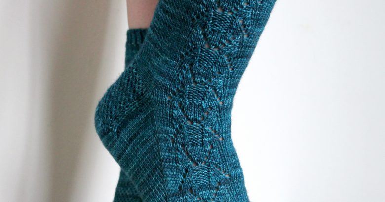 Blue socks with a column of lace up the outside of the foot