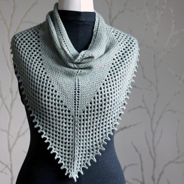 A triangular cowlette with a textured body, wide lace border and picot bind-off