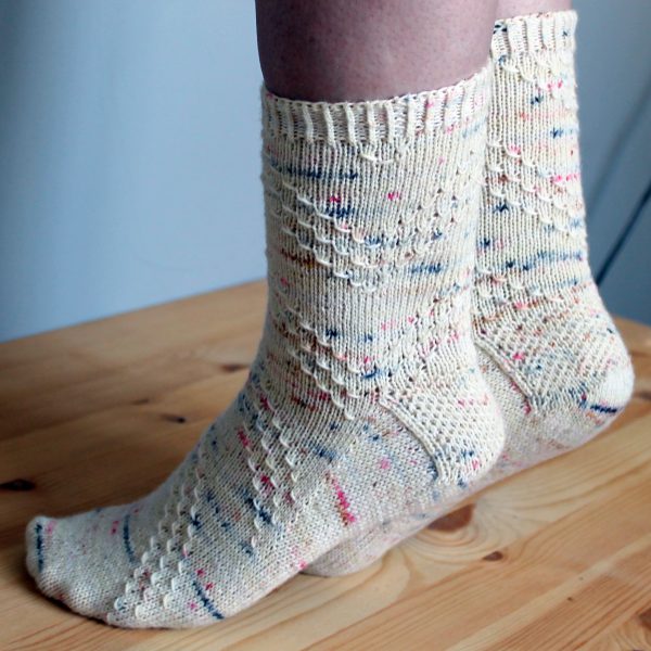 A pair of socks with a textured diagonal stripe mirrored on each foot