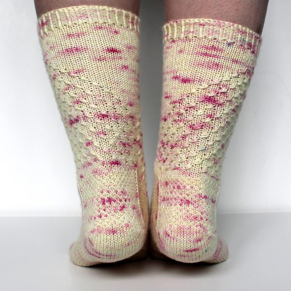 Speckled socks with a wide diagonal stripe with a textured pattern mirrored across each foot