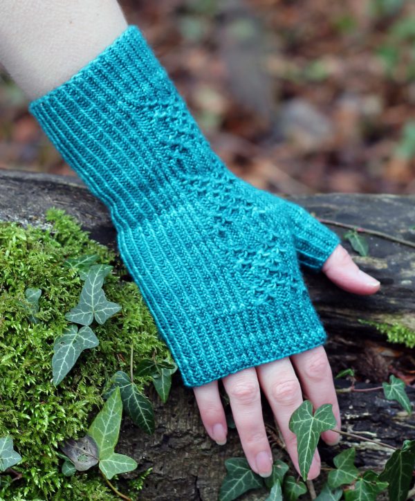 Twisted rib fingerless mitts with a smocked faux cable trellis patter asymmetrically on the back of the hand