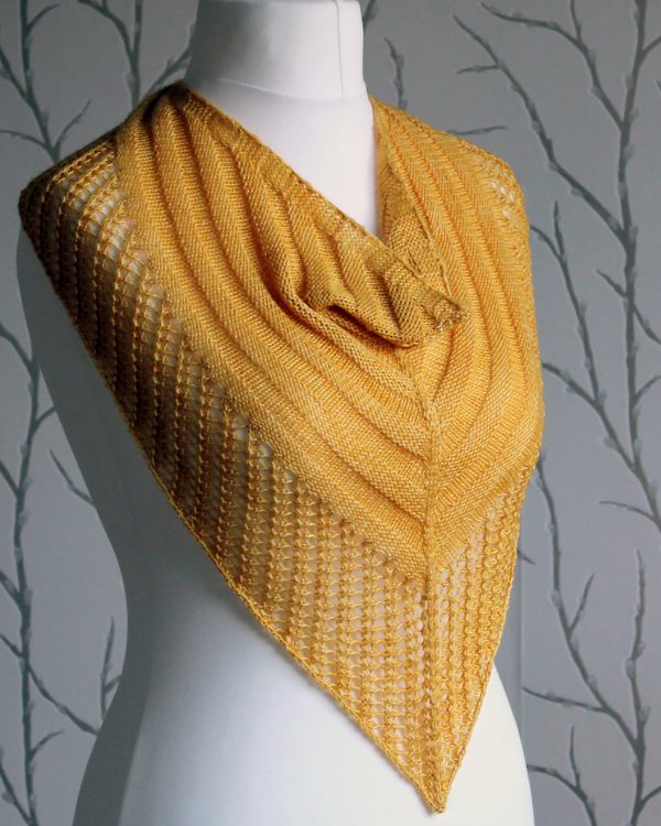 A yellow cowl with a ribbed body and wide lace border