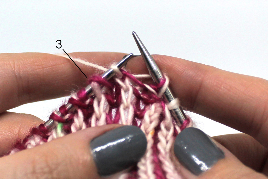The new stitch has been slipped to the left hand needle