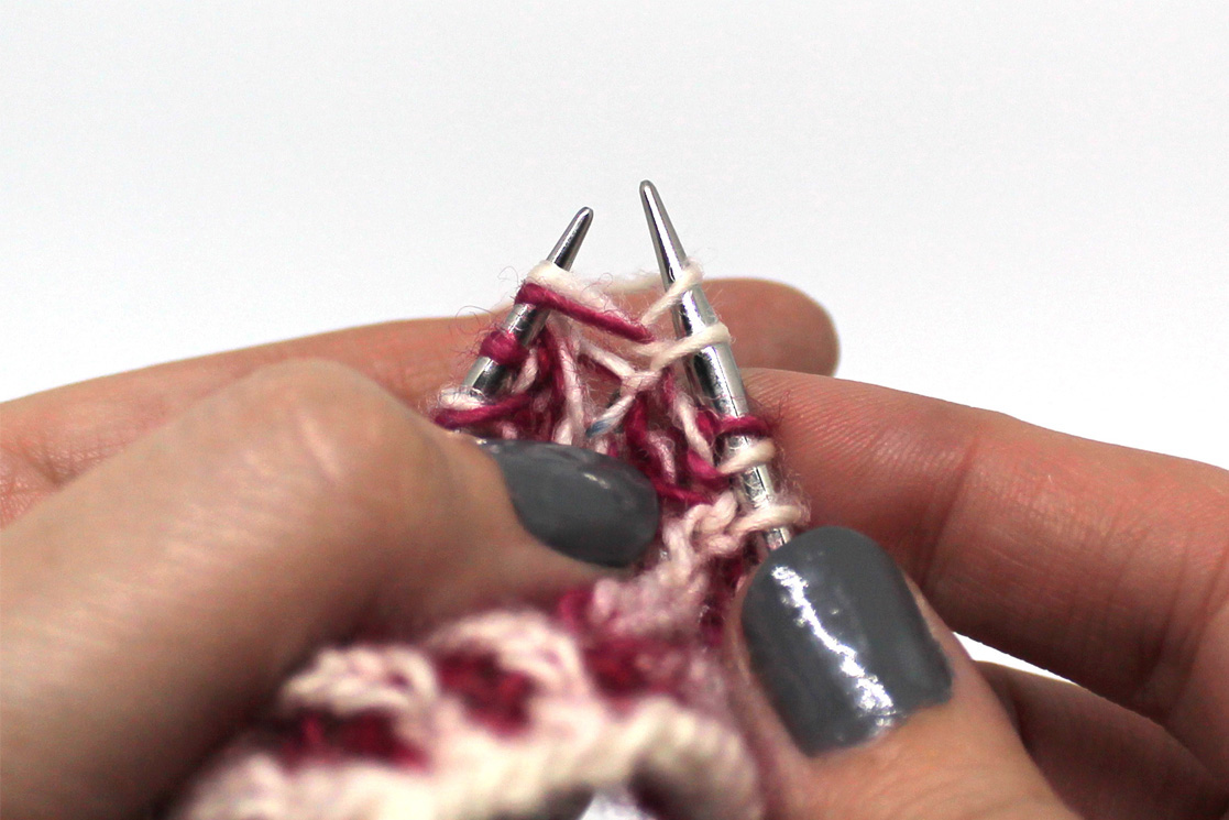 The same stitches as before, now with a yarn over on the right hand needle