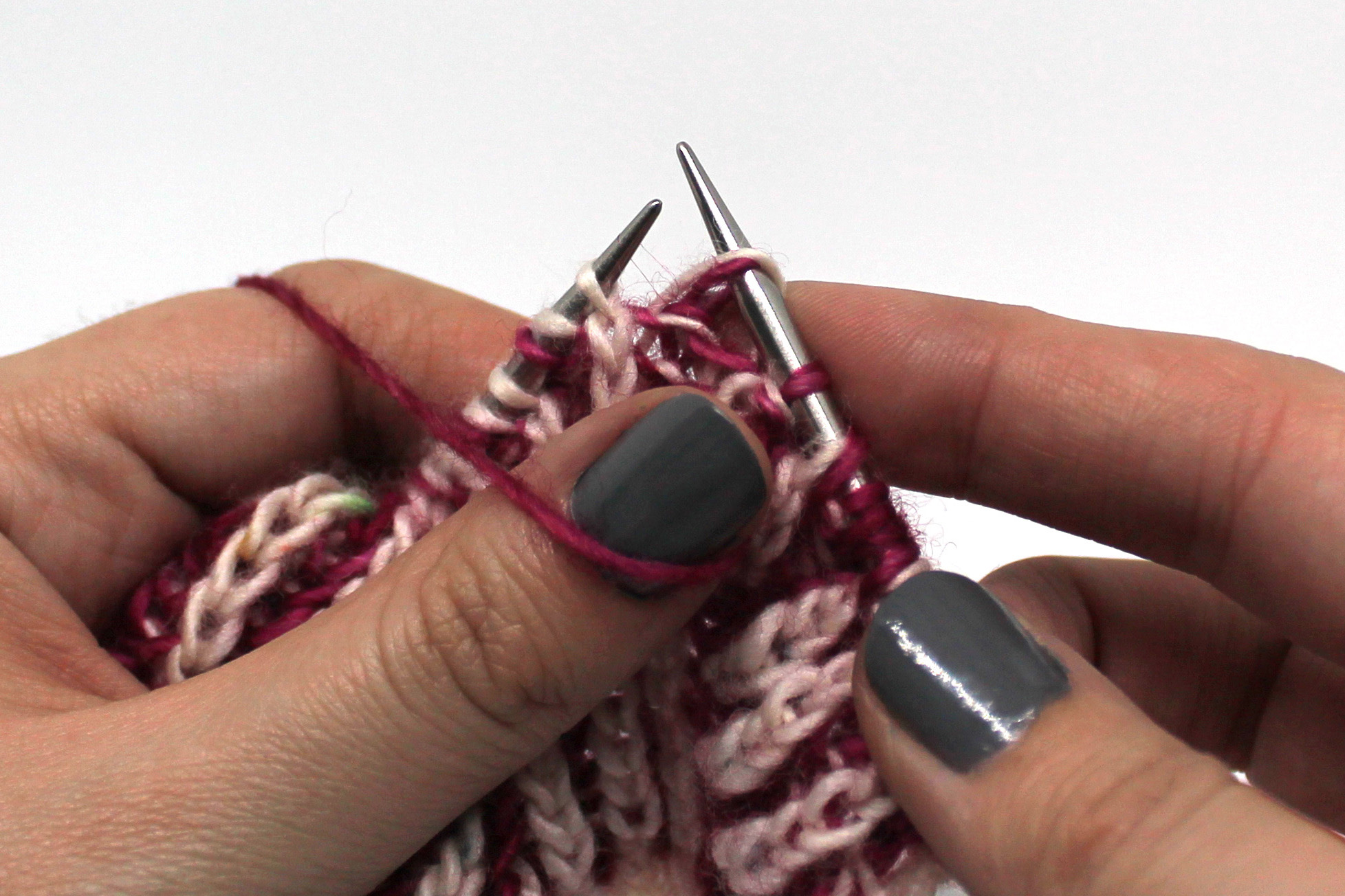 The first stitch on the left hand needle has been slipped knitwise to the right hand needle