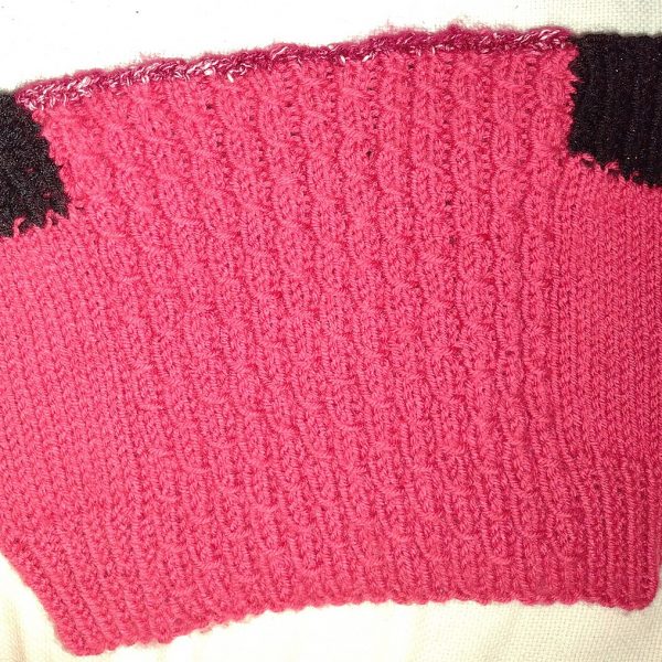 Dimitra knit her child sized Aisneach Cowl in a 70/30 Acrylic/nylon blend