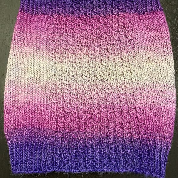 Emma used Blue Brick Escarpment Dk and made her Aisneach Cowl taller to make the most of the gradient!