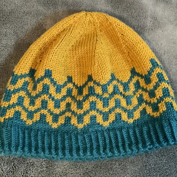 A made their Adult sized Pirl Hat in Yarn Bee Must be Merino