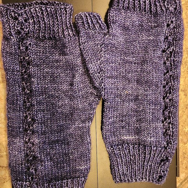 Gillian knit her size M1 mitts in 7th Floor Yarn Luscious Fingering