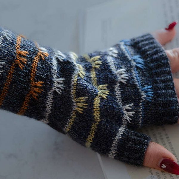 A fingerless mitt with coloured stripes and slipped stitches