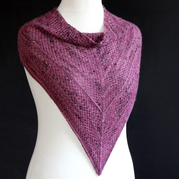 A cowlette knit in purple yarn with two brioche patterns and two slipped stitch bands